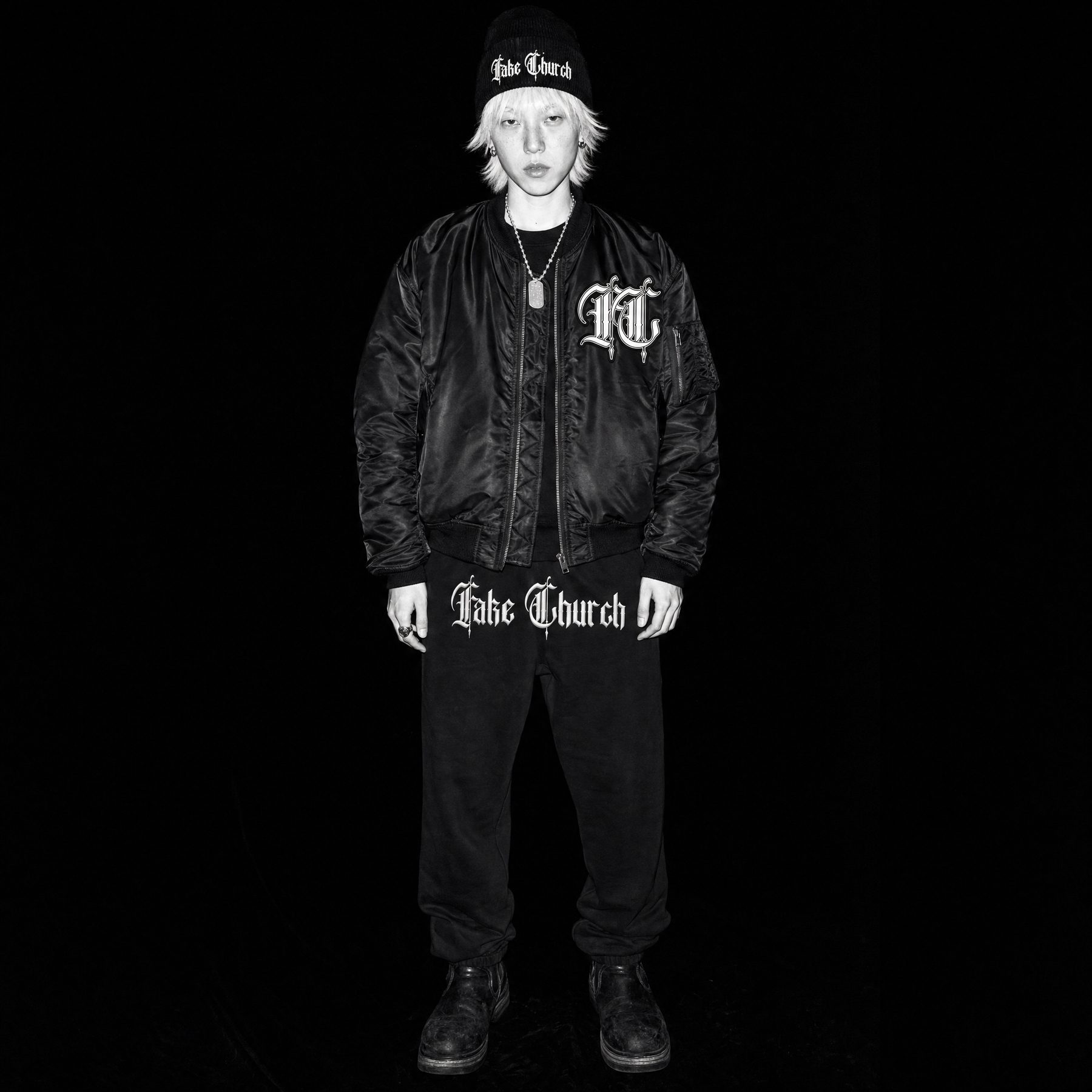 Look 01: a model with bleached hair in the MA-1 Bomber, Ribbed Beanie and Sweatpants